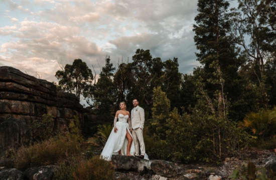 Bride and groom Laura and Ryan celebrating their relaxed wedding at Kangaroo Valley Bush Retreat surrounded by family, nature, and golden summer light.