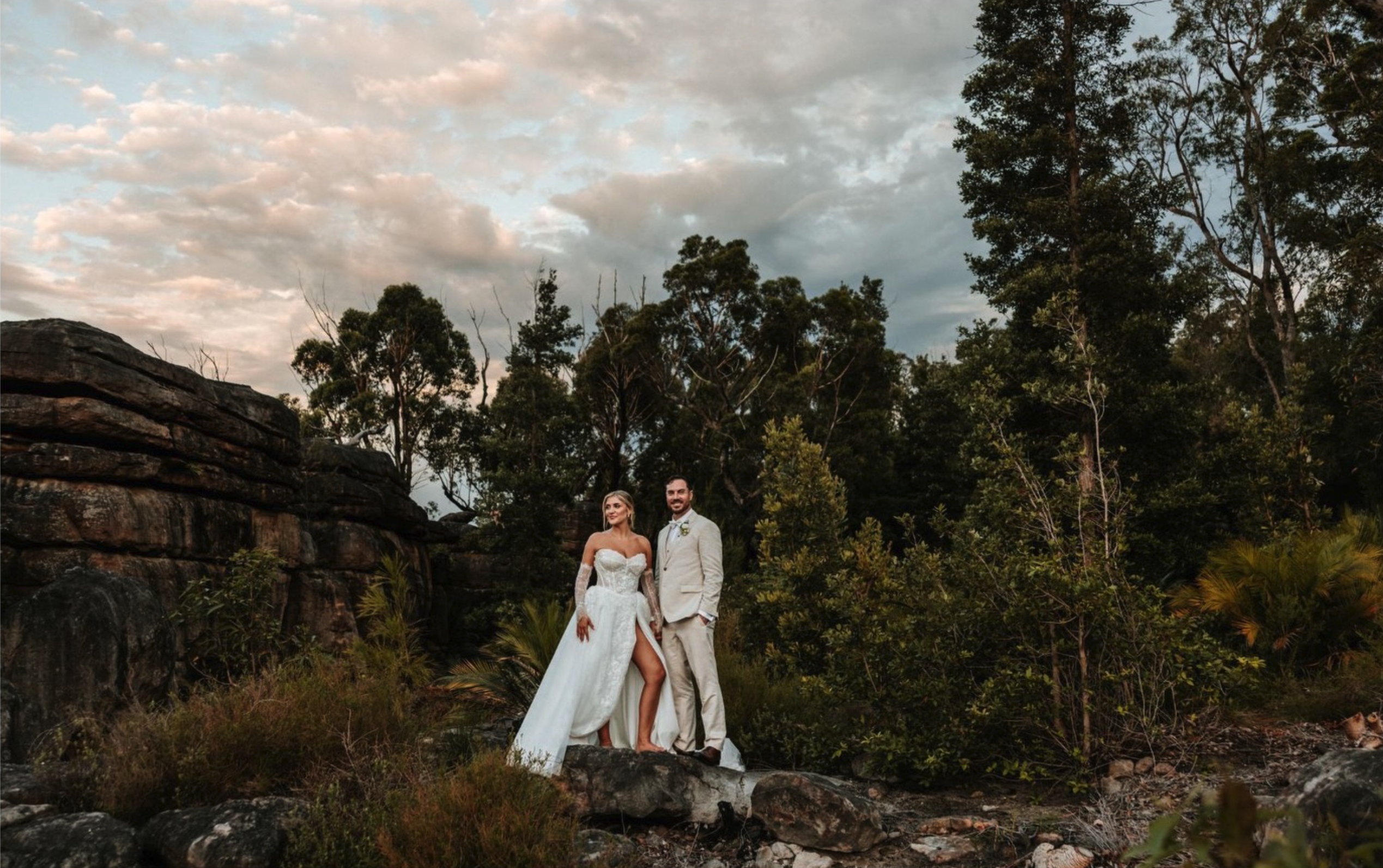 Bride and groom Laura and Ryan celebrating their relaxed wedding at Kangaroo Valley Bush Retreat surrounded by family, nature, and golden summer light.